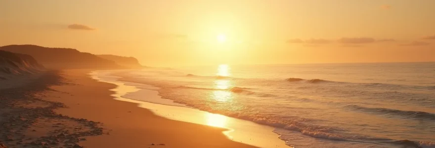 A serene sunrise over the calm ocean at Île de Ré with soft golden light, sandy beach, and gentle waves, embodying tranquility and seaside escape